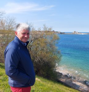 man standing by the coast